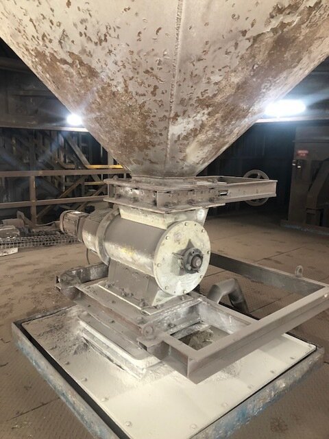 Original rotary airlock installed below a hopper