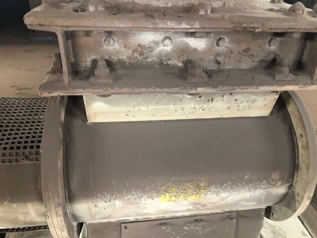 Worn original rotary airlock at a steel works
