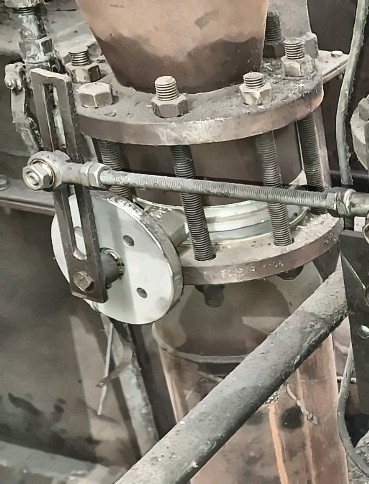 Butterfly damper and linkage on a steel plant hot air line